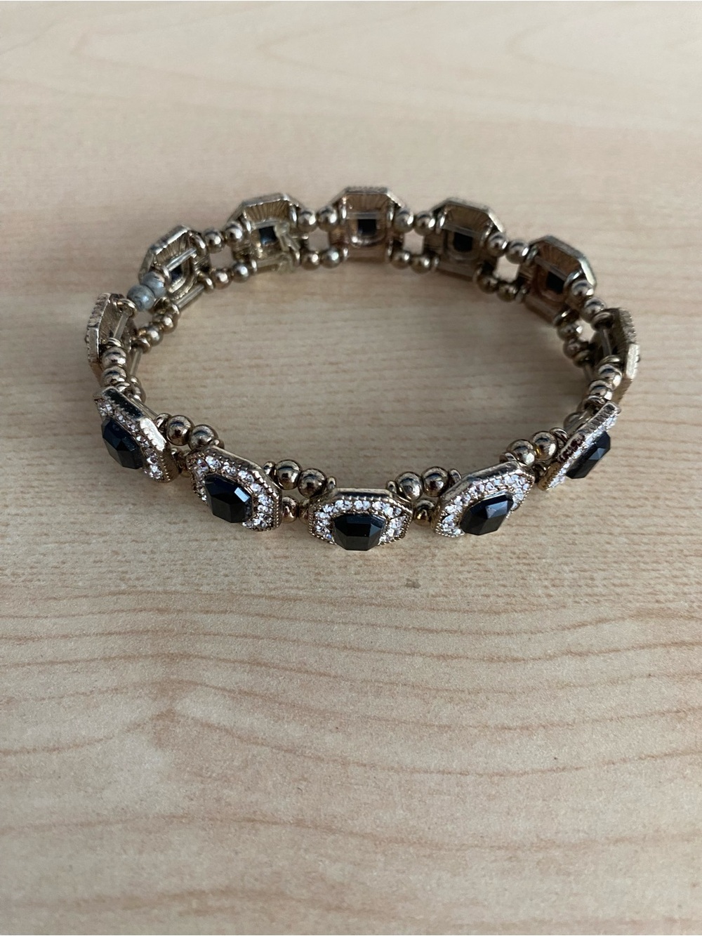 Elegant Gold-Tone Bracelet with Black Gem Accents